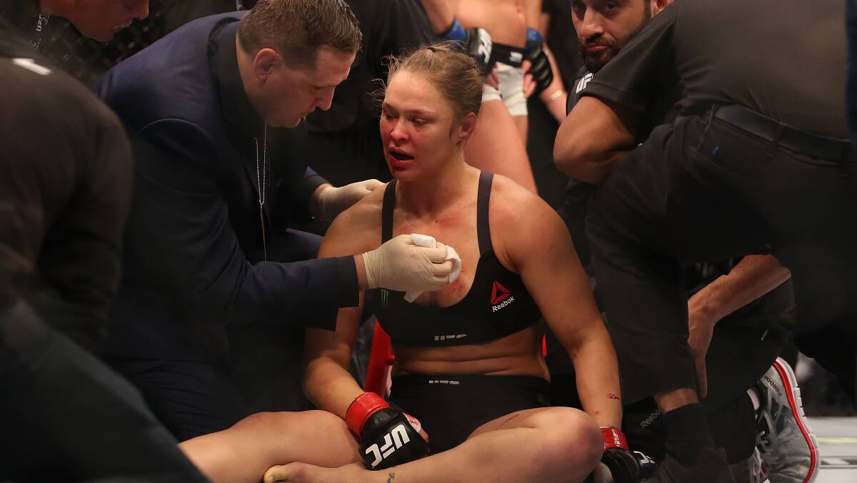 Ronda Rousey of the United States receives medical treatment after being defeated by Holly Holm of the United States in their UFC women's bantamweight championship bout during the UFC 193 event at Etihad Stadium on November 15, 2015 in Melbourne, Australia. Pic: Quinn Rooney/Getty Images