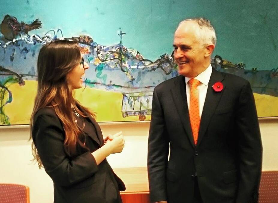MOVERS: Drisana shares a joke with with Prime Minister Malcolm Turnbull who she met with about her proposal on the human rights of deaf children to have access to Auslan from birth. Pic Facebook Drisanna Drisana Levitzke-Gray