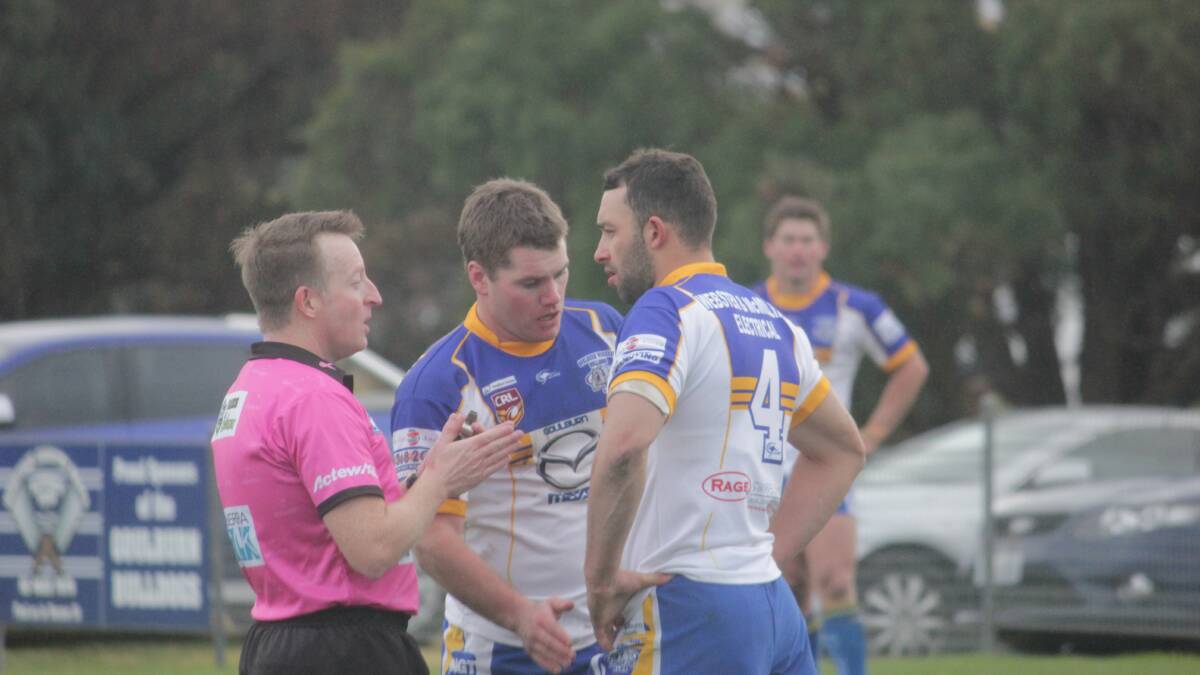 Bulldogs captain/coach Michael Picker has a discussion with a referee in the Bulldog's recent home game against the Belconnen Scholars. Photo: Chris Clarke