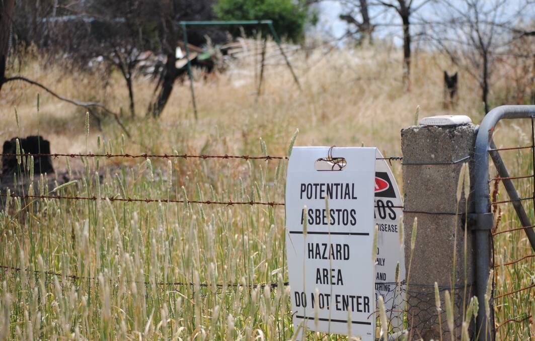 The Apps' are up in arms over council's inaction regarding an asbestos-plagued neighbouring property on the Hume Highway near Lachlan Valley Way. Photo: Jessica Cole. 