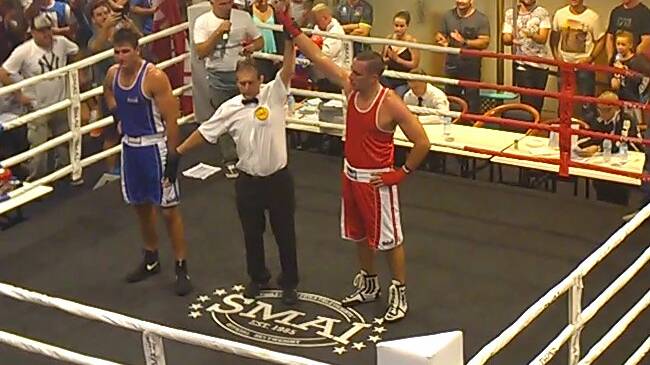 Nathan Merritt (right) claiming his third amateur boxing win recently.