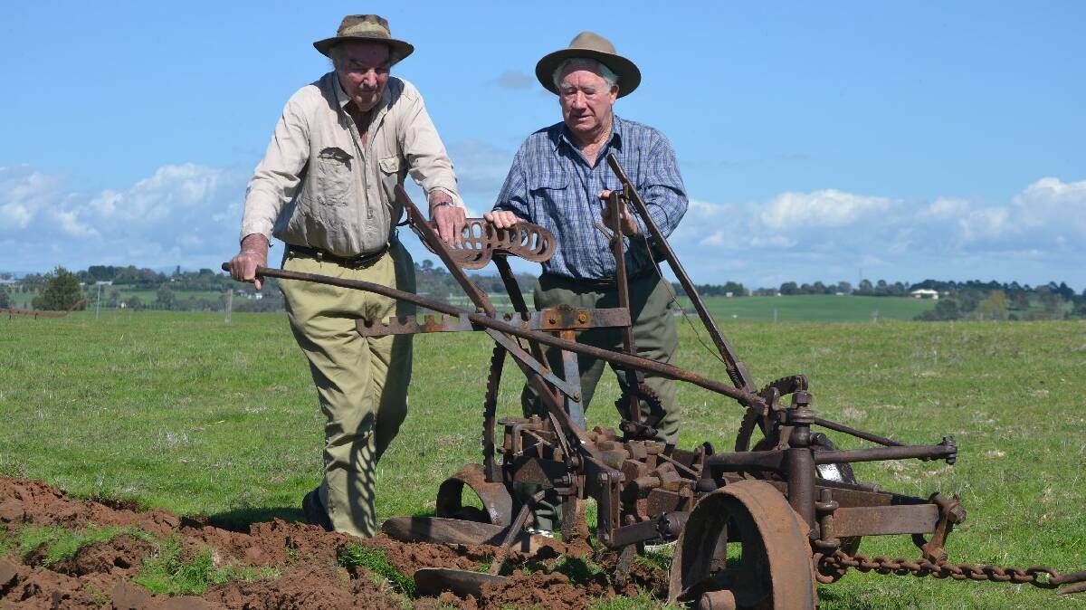 Bruce Rayner and Alan McGrath with Bruce’s 1920’s Clyde Plough. It will feature in the Woo Back record attempt next month. Photo: Oliver Watson.
