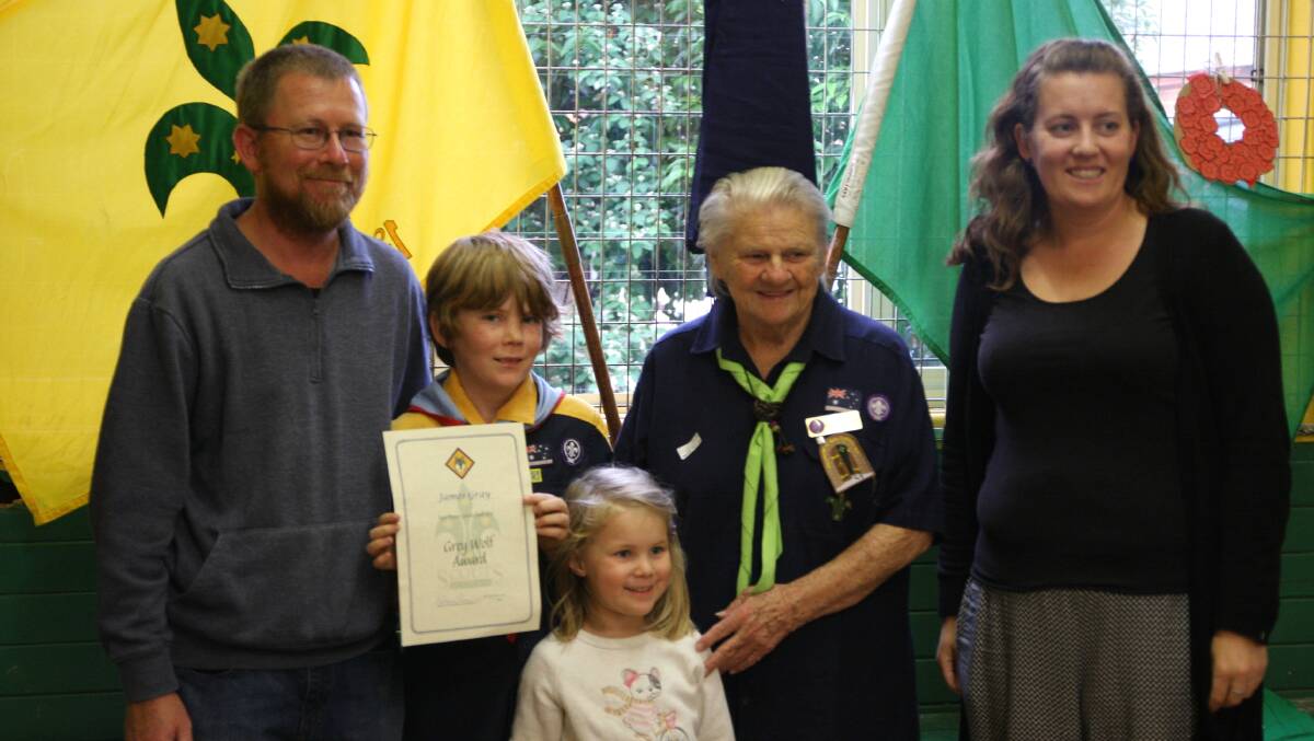 James Gray (holding the certificate) with his family and the Regional Commissioner for Scout Cubs (Riverina) Alice 'Bub' Johnstone.