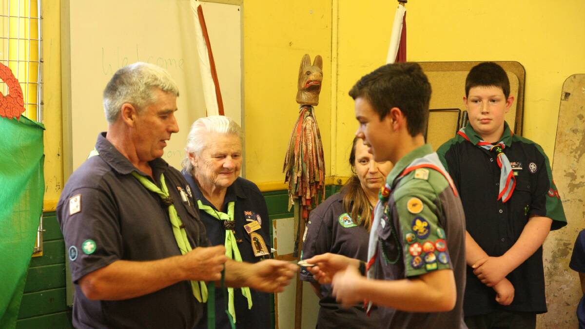 Mr Ian Petty, Regional Commissioner for Scouts (Riverina ) presenting the The Australian Scout Medallion to Braeden Adams. 