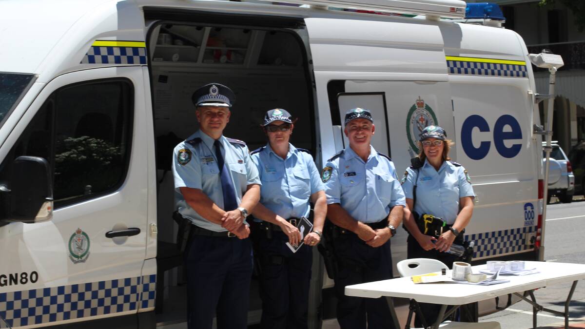 Officers attached to the Hume Local Area Command were out and about on Monday to discuss, with the public, the importance of White Ribbon Day. Photo: Jessica Cole.
