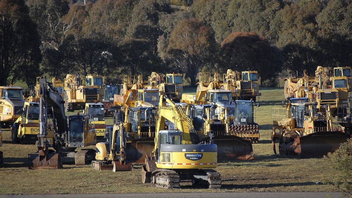 The auction of Hewatts fleet earthmoving equipment was expected to attract hundreds of bidders to the village yesterday. Photo: David Ellery.  