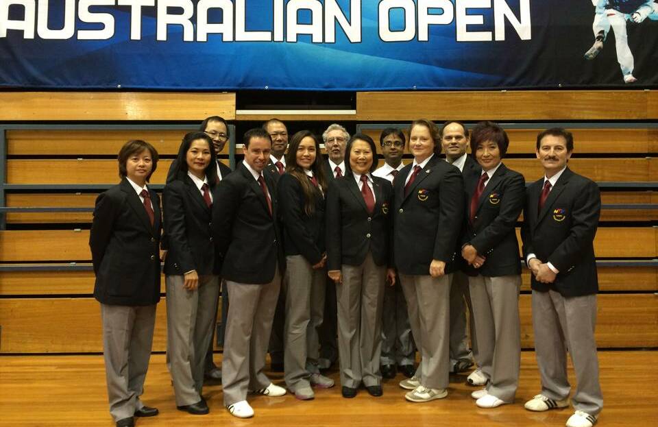 Craig Barrett has been chosen to referee at the prestigious World Poomsae Championships. Here he is (front, third from left) as an official at the Australian Open in August. Photo: Supplied.
