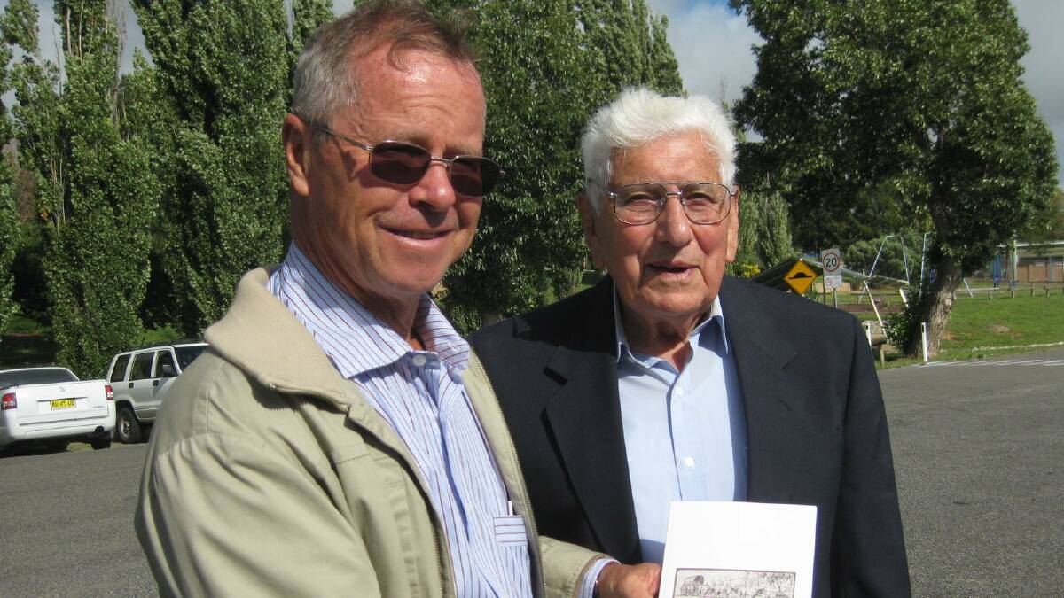 Mayor John Shaw congratulates Gunning author Keith Brown on the publication of his book "The Day that Dunkley Died".