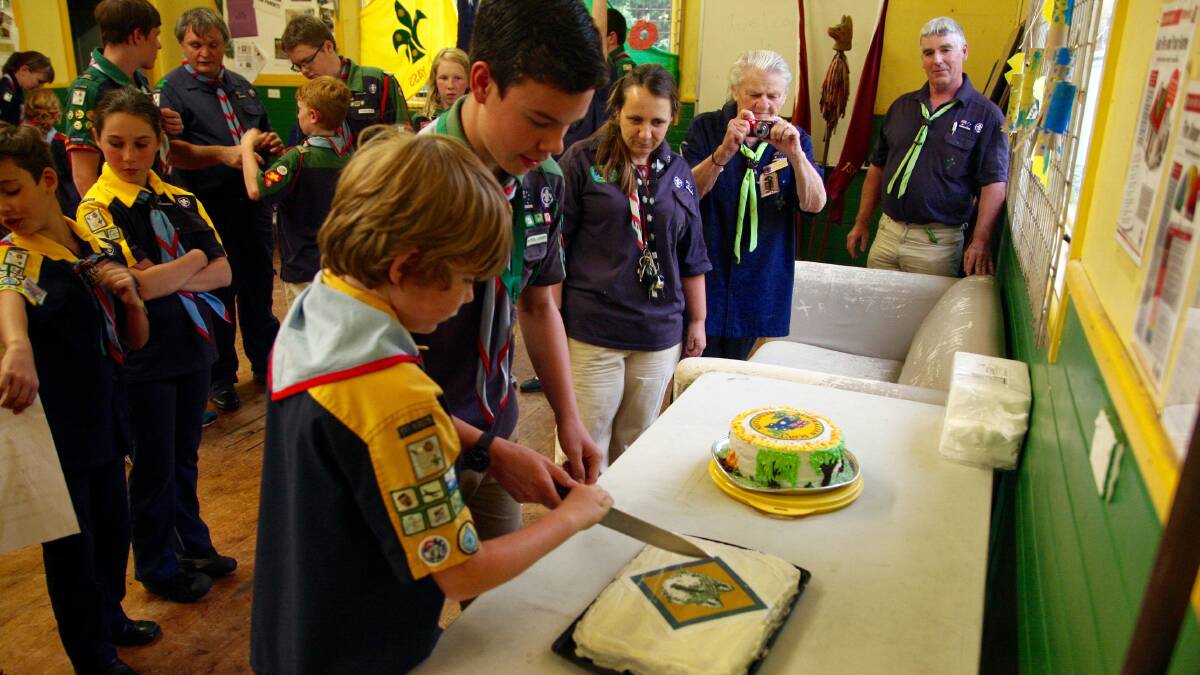 James Gray and Braeden Adams enjoy a cake after they were presented with awards. 