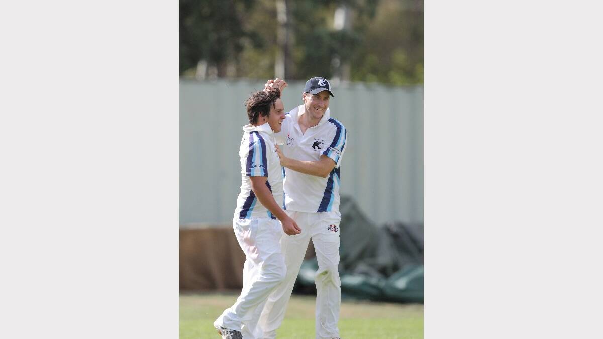 Jackson Chatfield is congratulated by teammate and Soldiers Club captain David Field after taking a catch on Saturday. Photo: RS Williams.