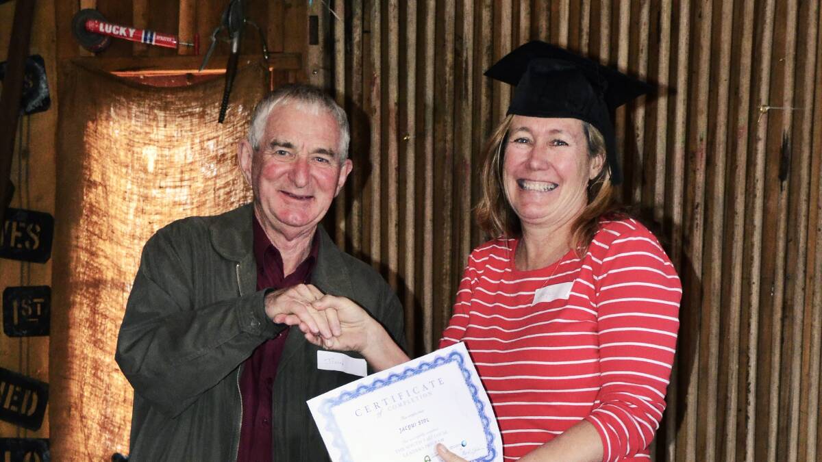 Jacqui Stol, from Murrumbateman, receives her South East Local Leaders graduation certificate from South East Landcare representative John Carter.
