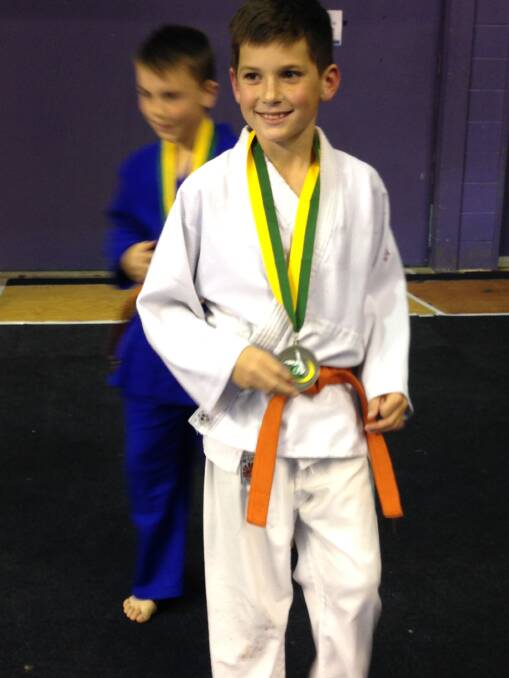Eight-year-old Riley Hamilton after winning a silver medal at the National Judo Tournament.
