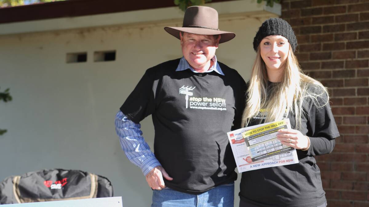 Stop The Sell Off campaigners in Bowning Peter Schofield and Alice Cox were in full voice at the weekend. Goulburn MP Pru Goward said she wants to sit down with local Transgrid employees as soon as possible to talk through the issues. Photo: RS Williams.
