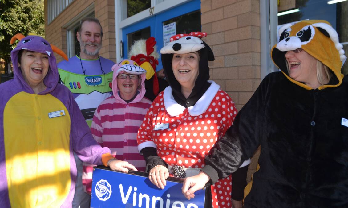 Carol Ede, Dave Fennel, June Smith, Sandy Fennel, Tina Fraigneux and Susie Hardy get dressed up for Vinnies winter sale. Photo: Joe McDonough.