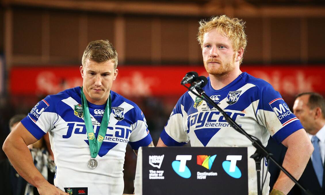 James Graham with Trent Hodkinson on stage after his side's 30-6 grand final loss. Photo: Getty.