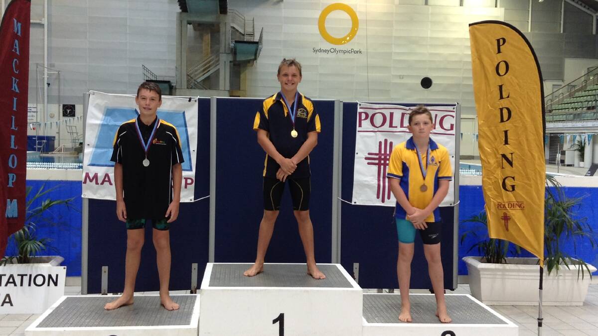 Thomas Carey atop the dais at the NSWCPS (NSW Catholic Primary Schools) swimming titles. Photo: Supplied.
