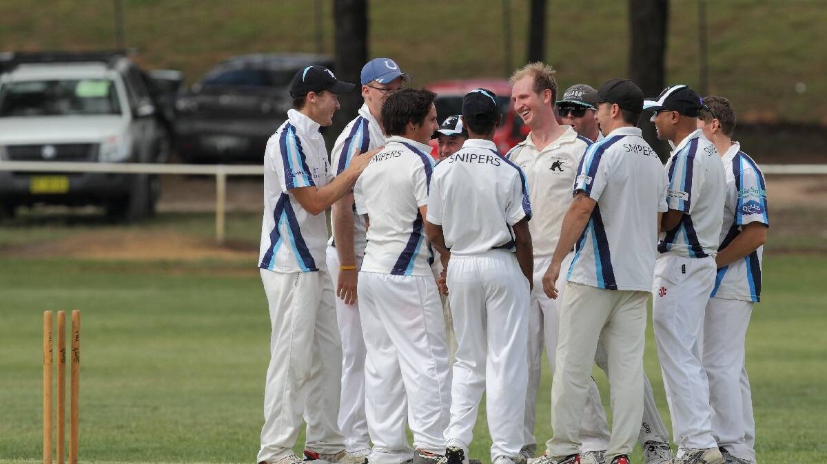 Steve Okkonen (middle) bowled well much to the joy of his Soldiers Club teammates. Photo: RS Williams.