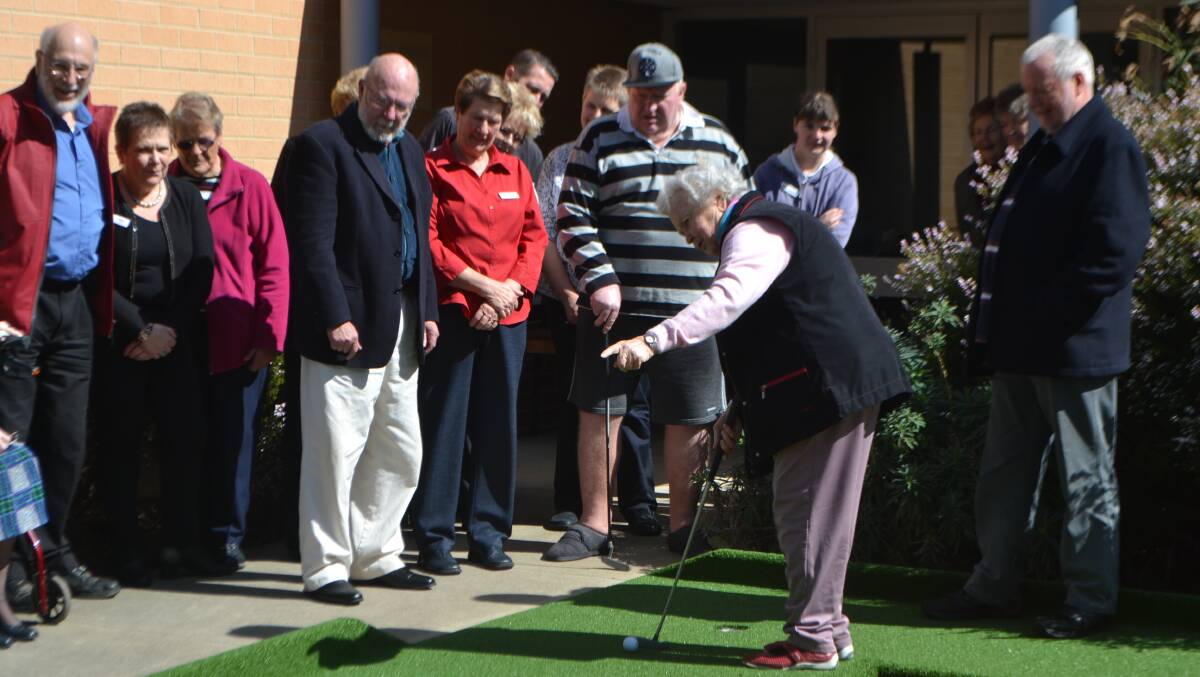  Resident Margaret was the first to try out the new two hole putt putt course.