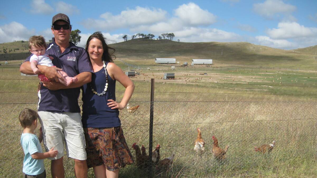 Craig and Theresa Robinson with two of their four children, William and Ayla, next to their free range poultry operation near Gunning. They and some of their neighbours are opposing a motocross development on an adjacent property. Photo: Supplied.