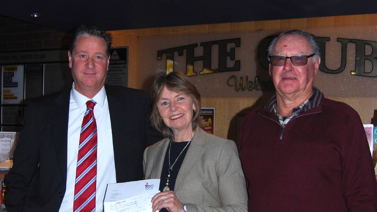 General Manager Yass Soldiers Club, Robert Packwood, presenting a cheque to Glenda Snape and Ken Reidy of the Yass Antique Motor Club for sponsorship of Classic Yass 2015. Photo: Supplied.
