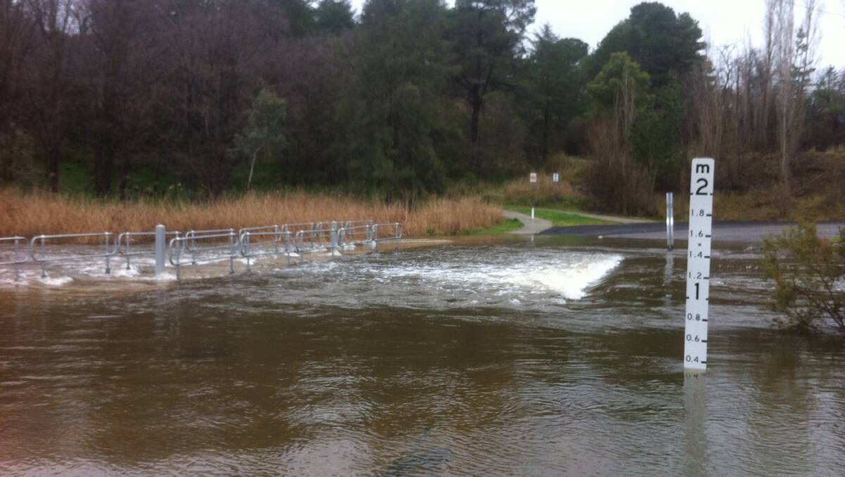 The Flat Rock Low Level Crossing was flooded due to the rain earlier this week. Photo: Leisa Doggett.