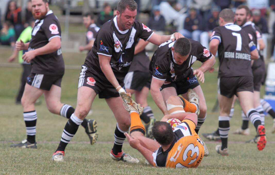 Magpies Ant Broers and Josh Hall show uncompromising defence against the Bungendore Tigers in their 18-10 minor semi final win. Photo: Jamie Williamson.
