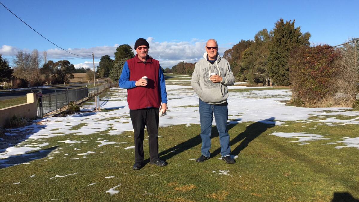 Keen Gunning golfers Laurie Stephenson and Peter Scott braved freezing conditions at the snow covered Crookwell Golf Course on Tuesday.