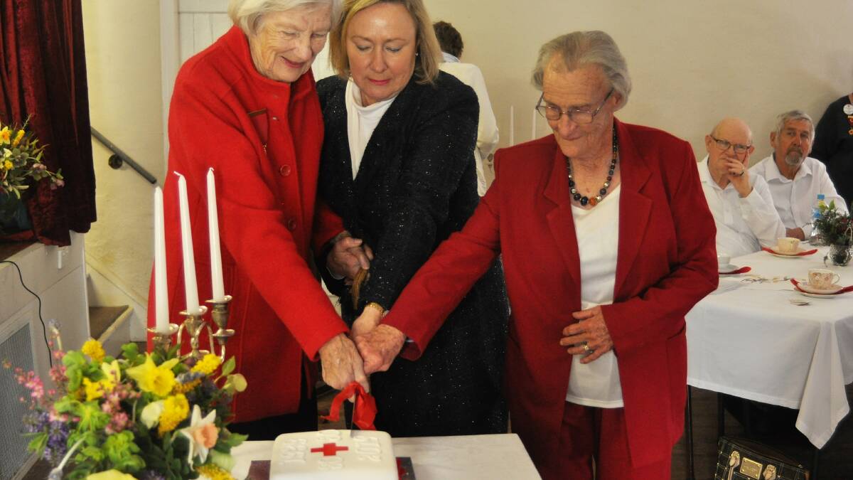 HAPPY ANNIVERSARY: Bookham Berremangra Red Cross member for 70 years Helen Shannon, Yass Valley mayor Rowena Abbey and Bookham Berremangra Red Cross patron June Stevens.