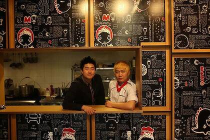 Fusion food ... manager Min Chung and head chef Duke Kim at Mario Tokyo, a Japanese-influenced pizza and pasta restaurant in Strathfield.