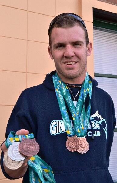 Rhind pictured after returning home with a host of medals from a meet last year.