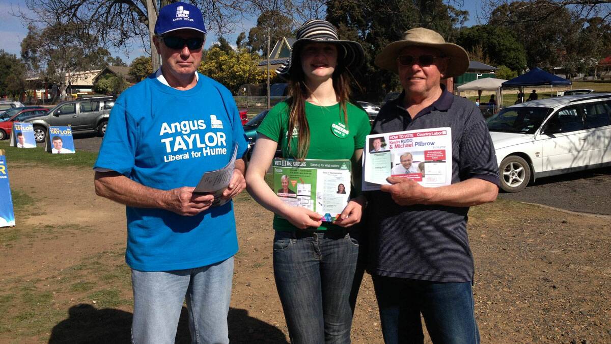 Ken Lockyer, Lillian Dorman and Bengt Andersson were on site to hand out how-to-vote cards. Photo BRITTANY MURPHY.