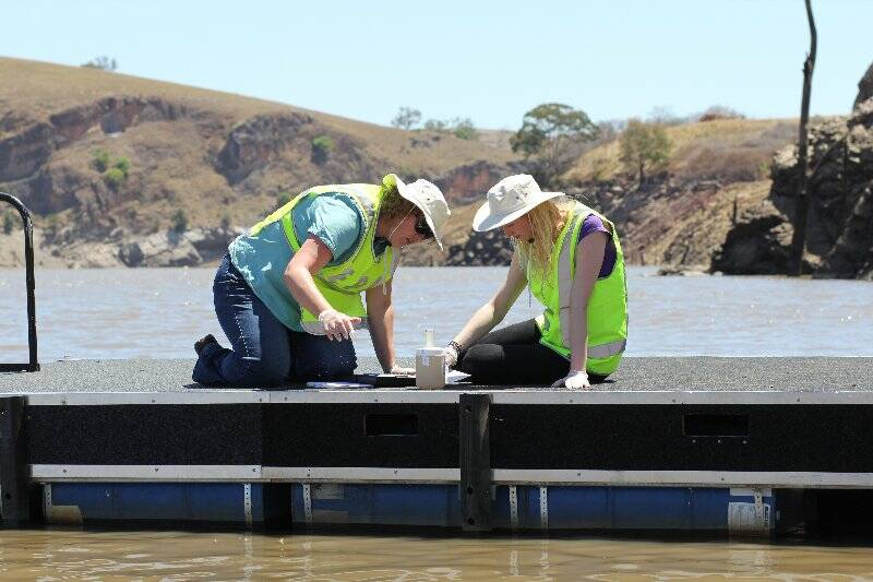 WATER QUALITY: Sandie Jones and Claire Hindle from the Environment Protection Authority testing the water at Hume Park.