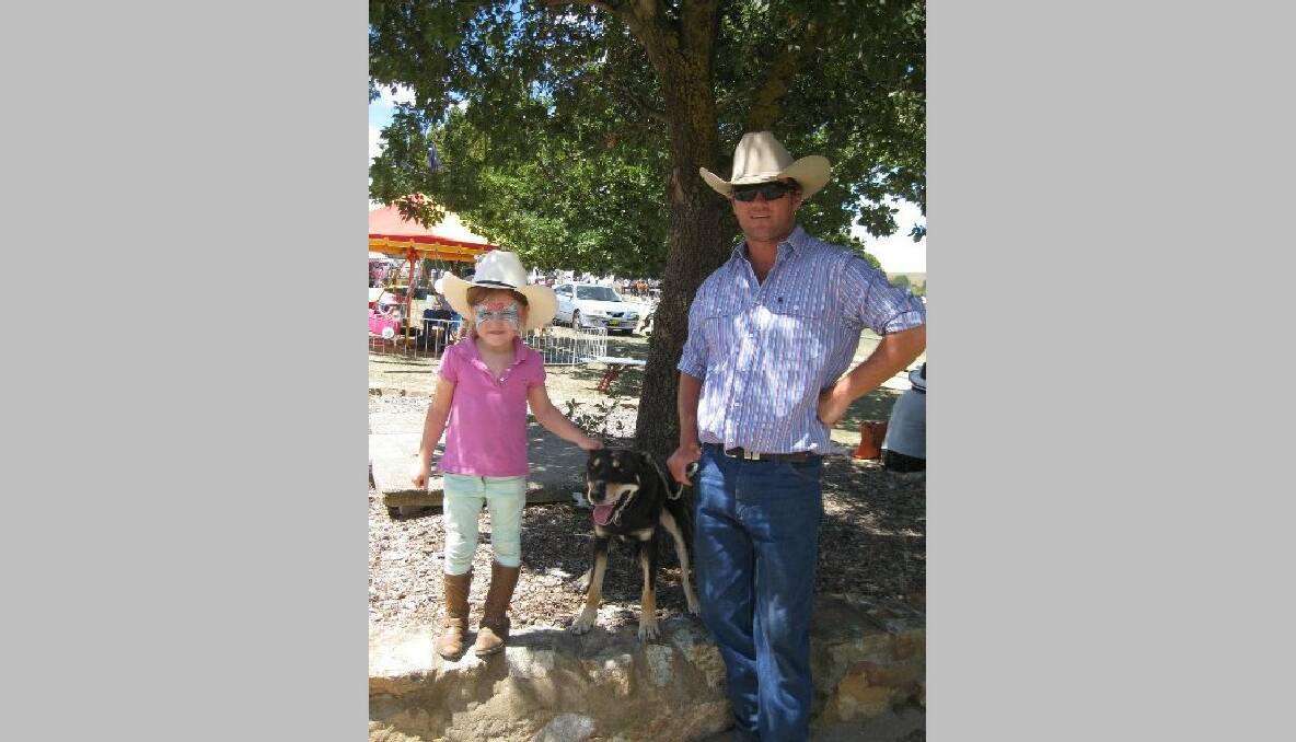 Mitch Duffy from Yass with his daughter Lily, 4, and sheep dog Ninja competed in the yard dog trials at the Gunning Show.