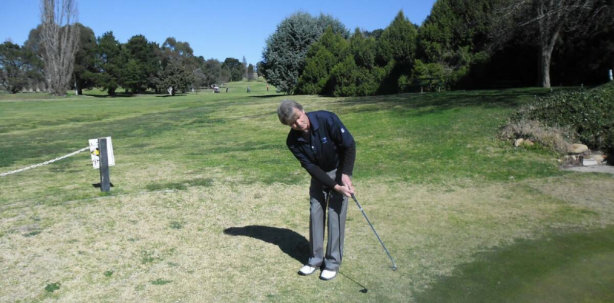 Graham Fleming, this weekend's sponsor and current local leader of the ACTDGA Stableford Championships, practicing his chipping before his game on Saturday.