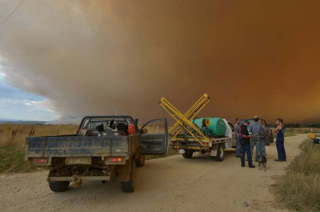 Cowwarr locals watch for embers near their property as fires burn in Gippsland. Photo: Michael Clayton-Jones