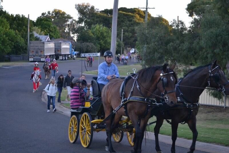 The group makes it's way through the streets of Yass at the weekend.
