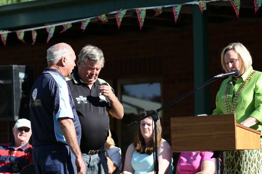 Ken Bell and Rod Wise accept the Community Group award on Saturday on behalf of the Yass Touch Association.