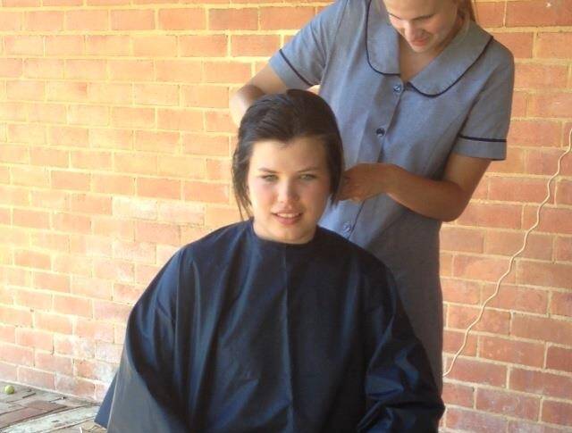 A cleanly shaven Elysha Kelly after her hair chop recently. Elysha raised more than $1000 for cancer research.