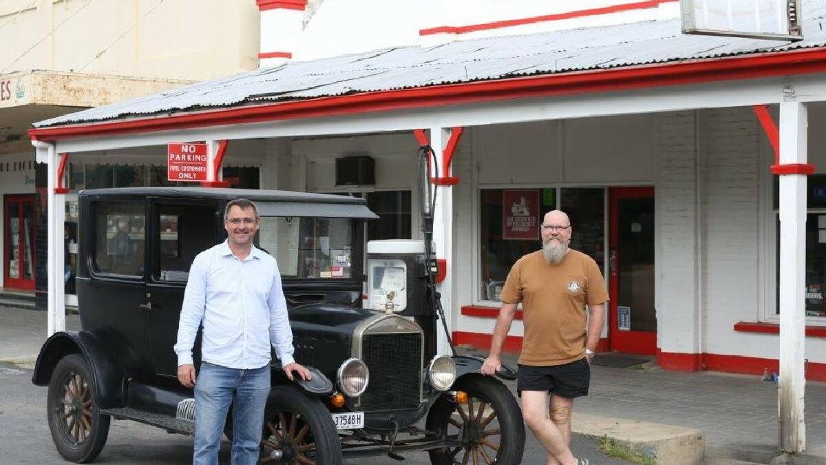 Model T Ford owner Andrew Benoit with Craig Southwell, current proprietor of Bailey's Garage.