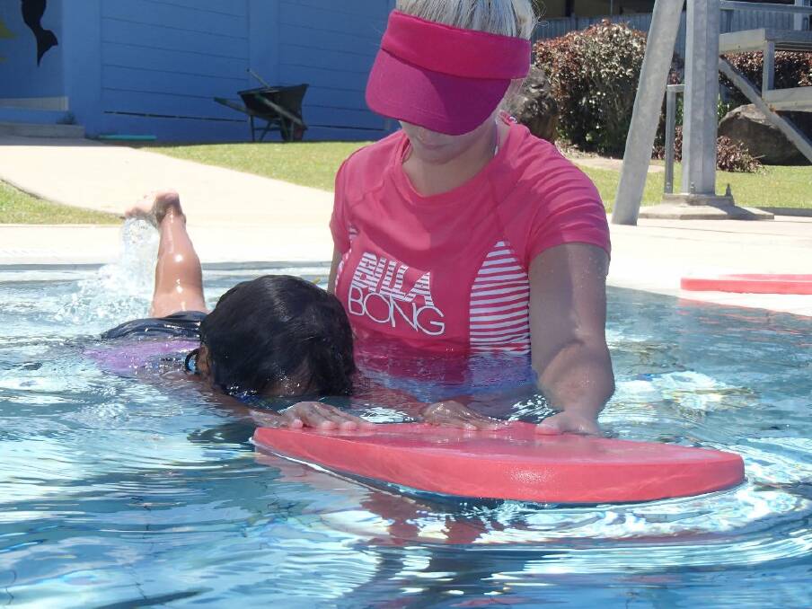Kate Wylie and Tia Spencer teach Yarrabah locals the lifesaving skill of swimming.