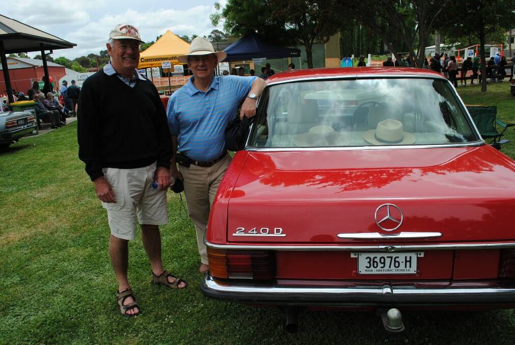 Keith Farner and Paul Johnson check out a Mercedez.