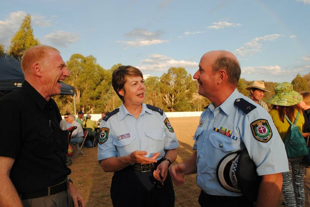 Anglican minister Ken Rampling. Yass Police chaplain Judy Heggart and police chaplain for the southern region Steve Nuehaus share a laugh at the Bookham barbecue on Monday evening, which brought together those affected by the recent bushfire.