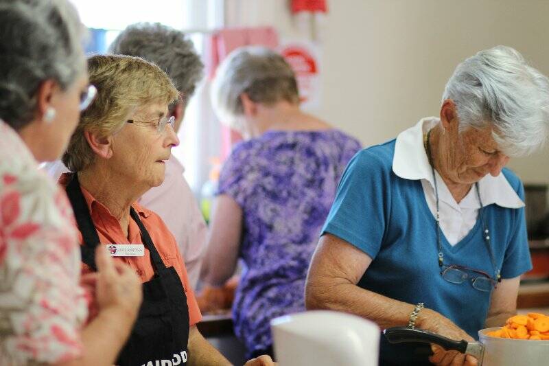 The kitchen is a busy place every night at BlazeAid's base camp at the Bookham Memorial Hall. Photo: Tiffany Grange