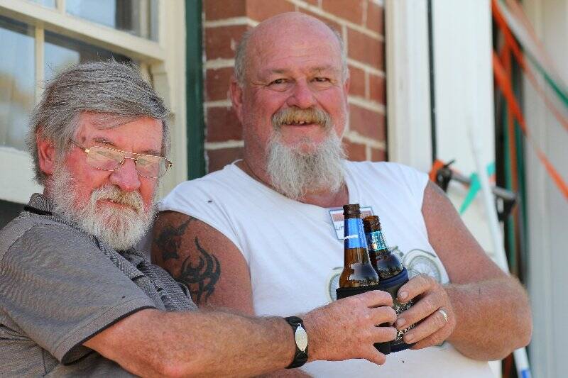 Brian Dunkley of Cowra and John Cumberland of Macksville enjoy a well-earned drink. Photo: Tiffany Grange.
