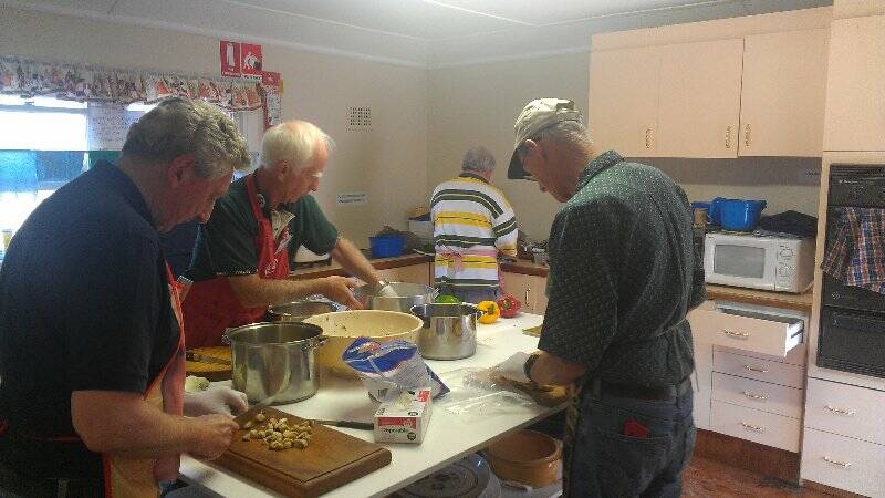 Phil O'Brien, Joe Morrissey, len McGuigan and Roger Holgate hard at work preparing a meal for BlazeAid volunteers.