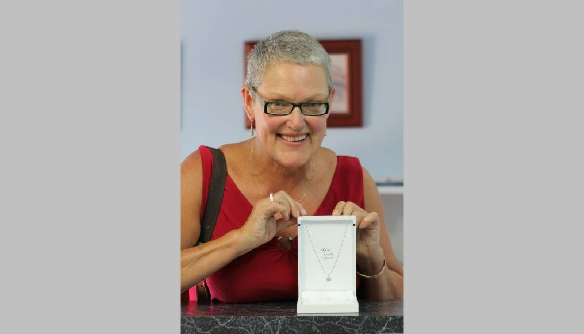 Dance organiser Sue Gaffney with a $2000+ diamond necklace donated by Yass Jewellers for Saturday night's auction.