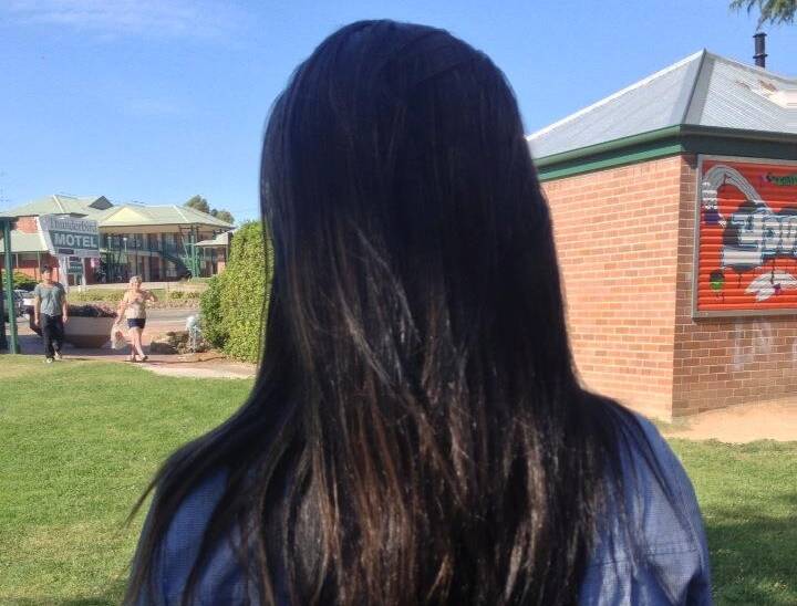 Here Elysha is at school, right before she has her head shaved.