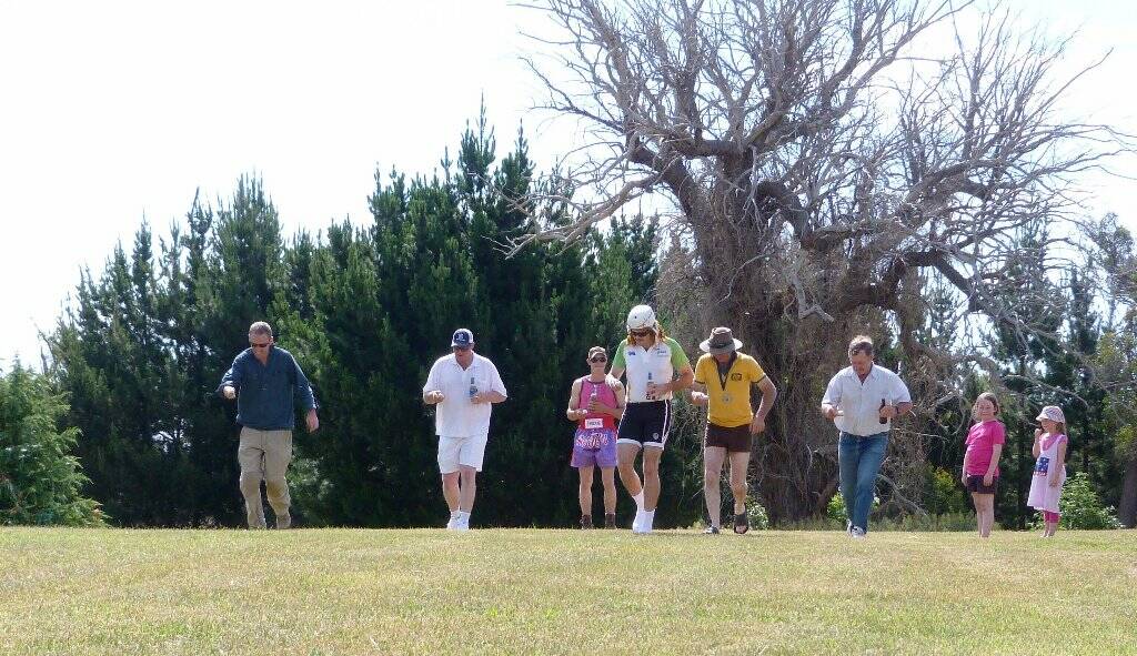 Men's egg and spoon race.
