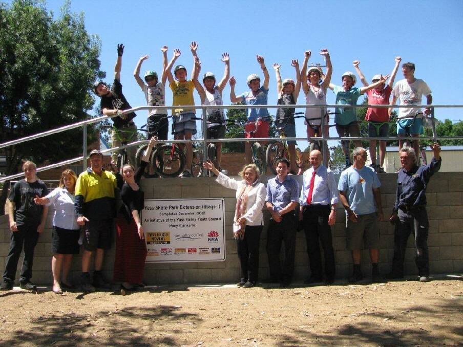 A group of locals including councillors and skatepark users celebrate the new and improved park.