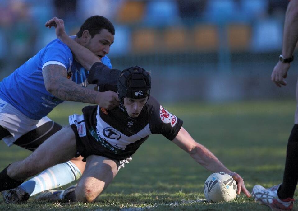 Centre Steve Naughton touches down for a try during the Magpies' win on the weekend. Photo: RS WILLIAMS